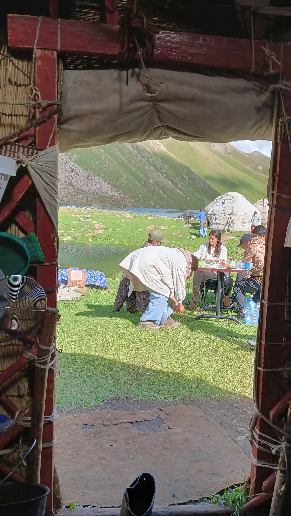 Nomadic campside sourrounded by rivers and open grass lands
