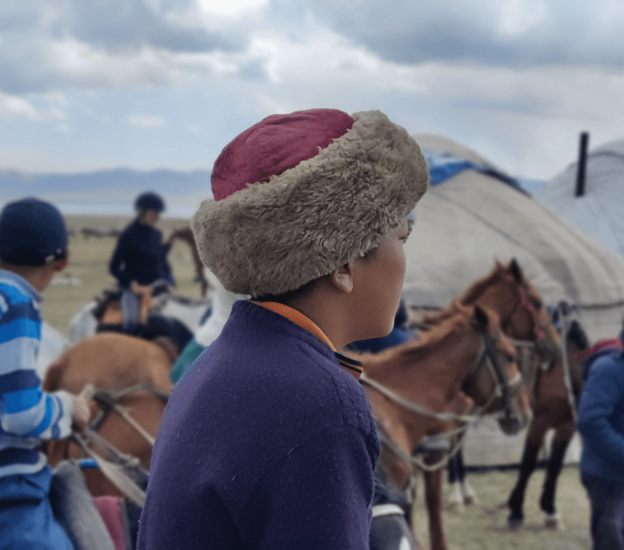 Kyrgyz child in traditional rural surroundings in the mountains of Kyrgyzstan